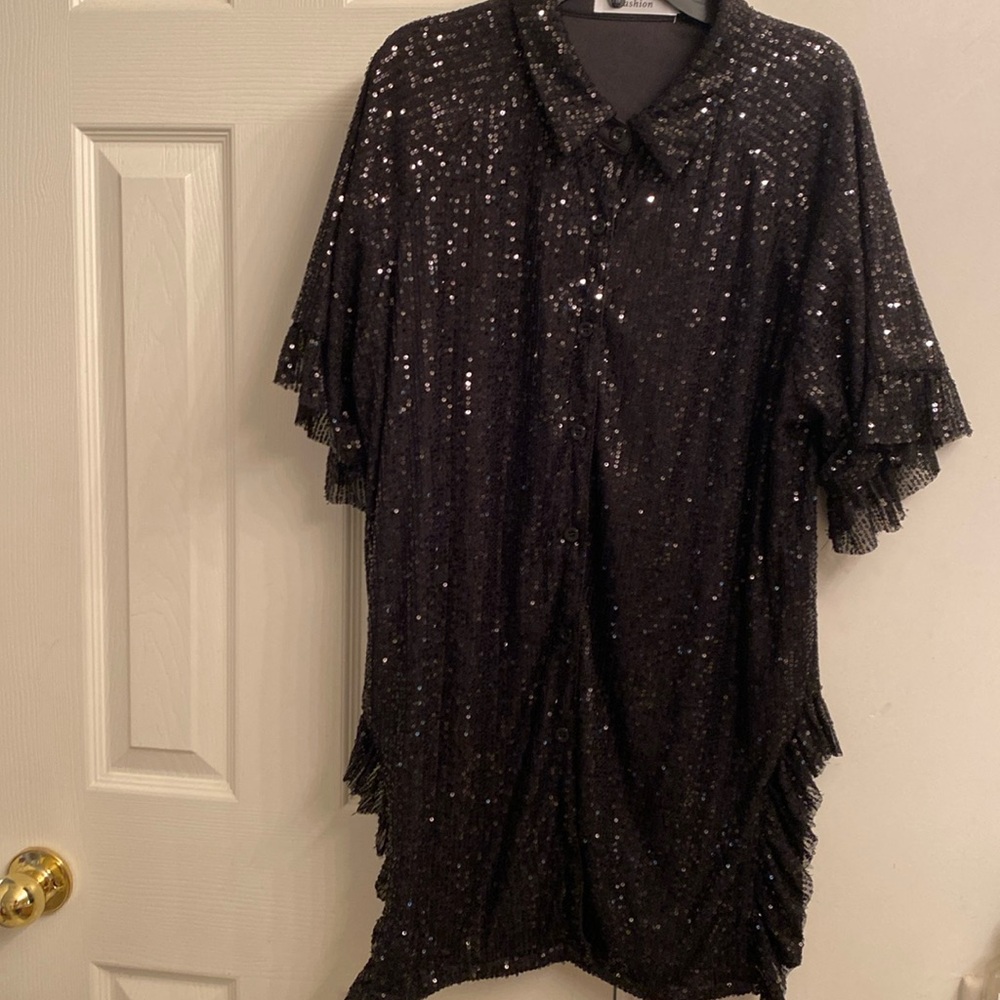 Beautiful party top with sequins. Button down with side slits.